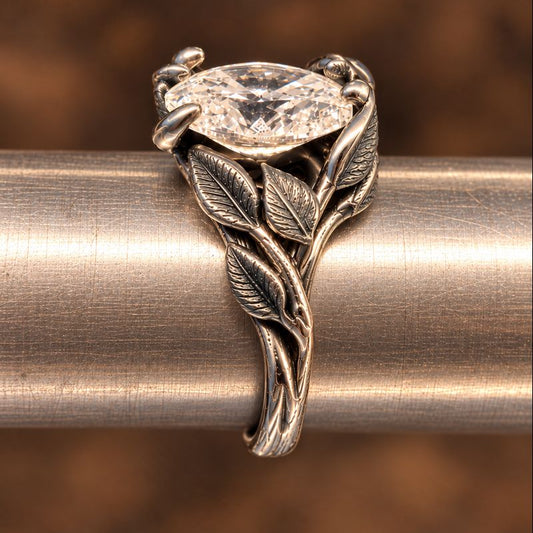 white gold ring with leaves surrounding a lab diamond
